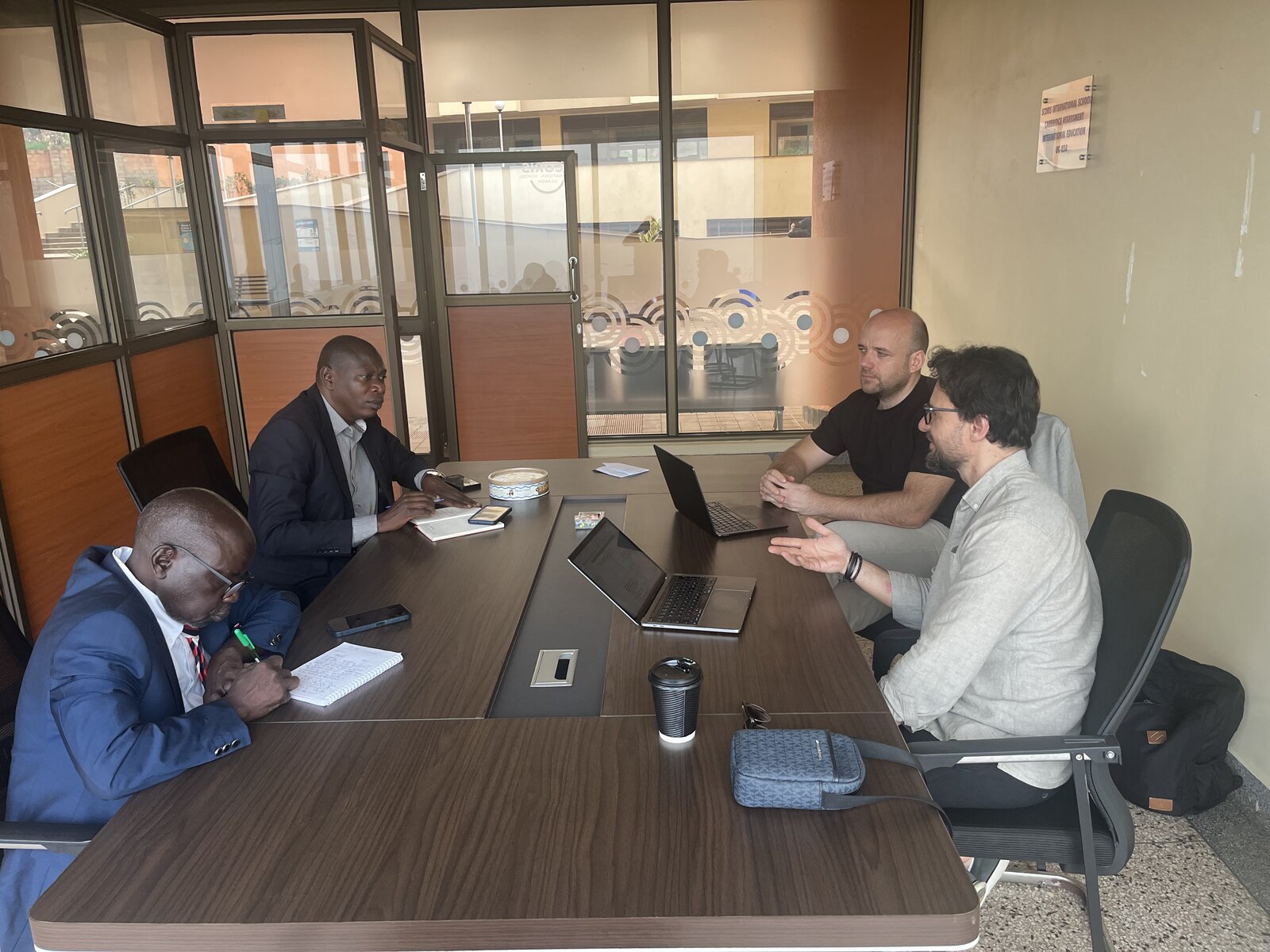 Founders in a strategy meeting with school leaders